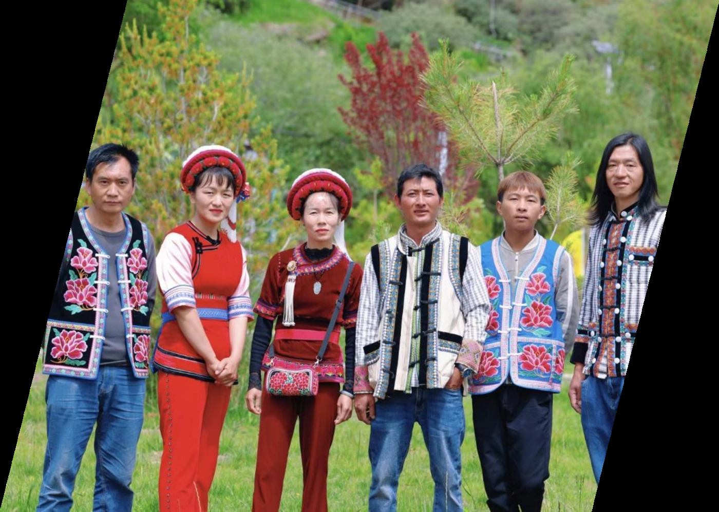 Estate colleagues from several ethnic groups standing together in the fields