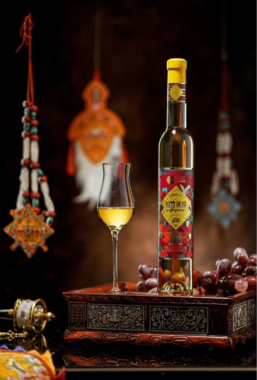 Icewine 3716, half bottle beside a glass of golden icewine